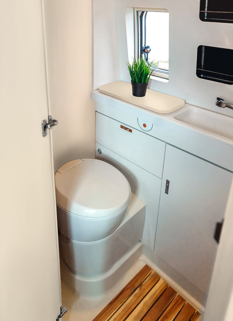 Bathroom in a RV / Caravan featuring 3mm Cappuccino Vanply for interior caravan wall panels and cabinets from Melbourne plywood supplier Plyco without a white background