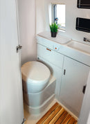 Bathroom in a RV / Caravan featuring 3mm Cloud Vanply for interior caravan wall panels and cabinets from Melbourne plywood supplier Plyco without a white background