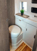 Bathroom in a RV / Caravan featuring 3mm Graphite Oak Vanply for interior caravan wall panels and cabinets from Melbourne plywood supplier Plyco without a white background