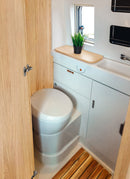 Bathroom in a RV / Caravan featuring 3mm White Oak Vanply for interior caravan wall panels and cabinets from Melbourne plywood supplier Plyco without a white background