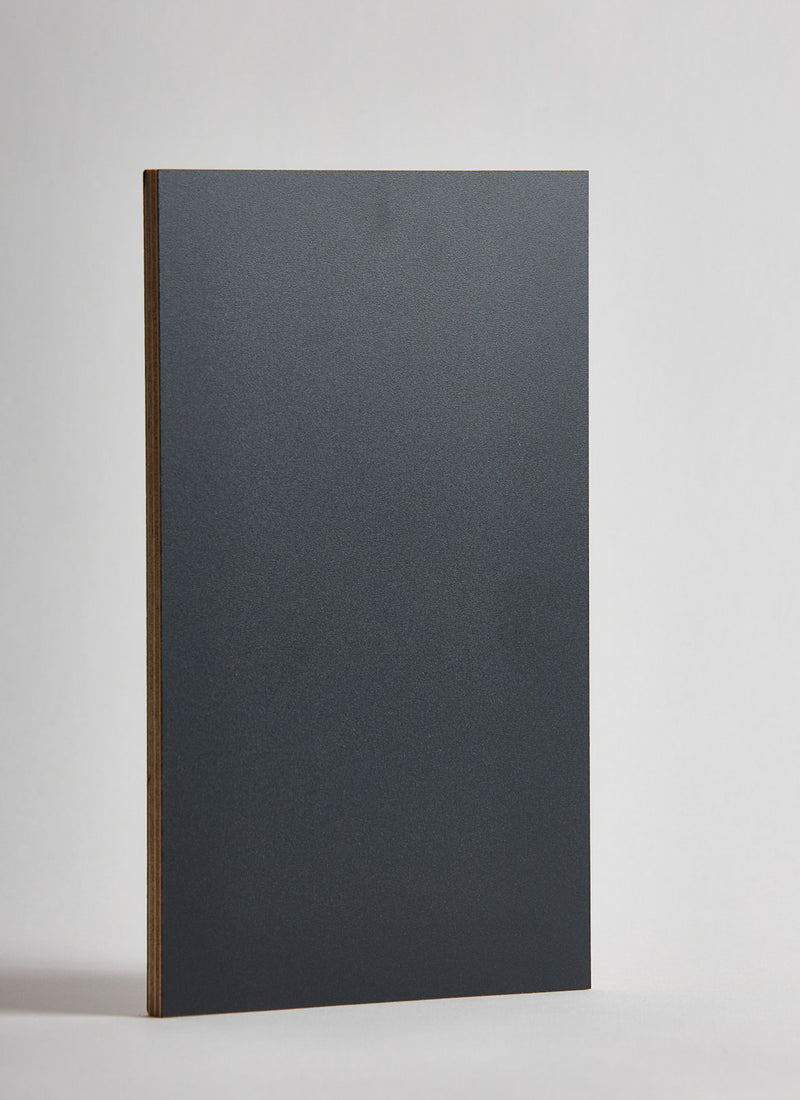 Plyco's Charcoal Decor Laminate pressed onto a Birch Plywood core (Decoply) on a white background